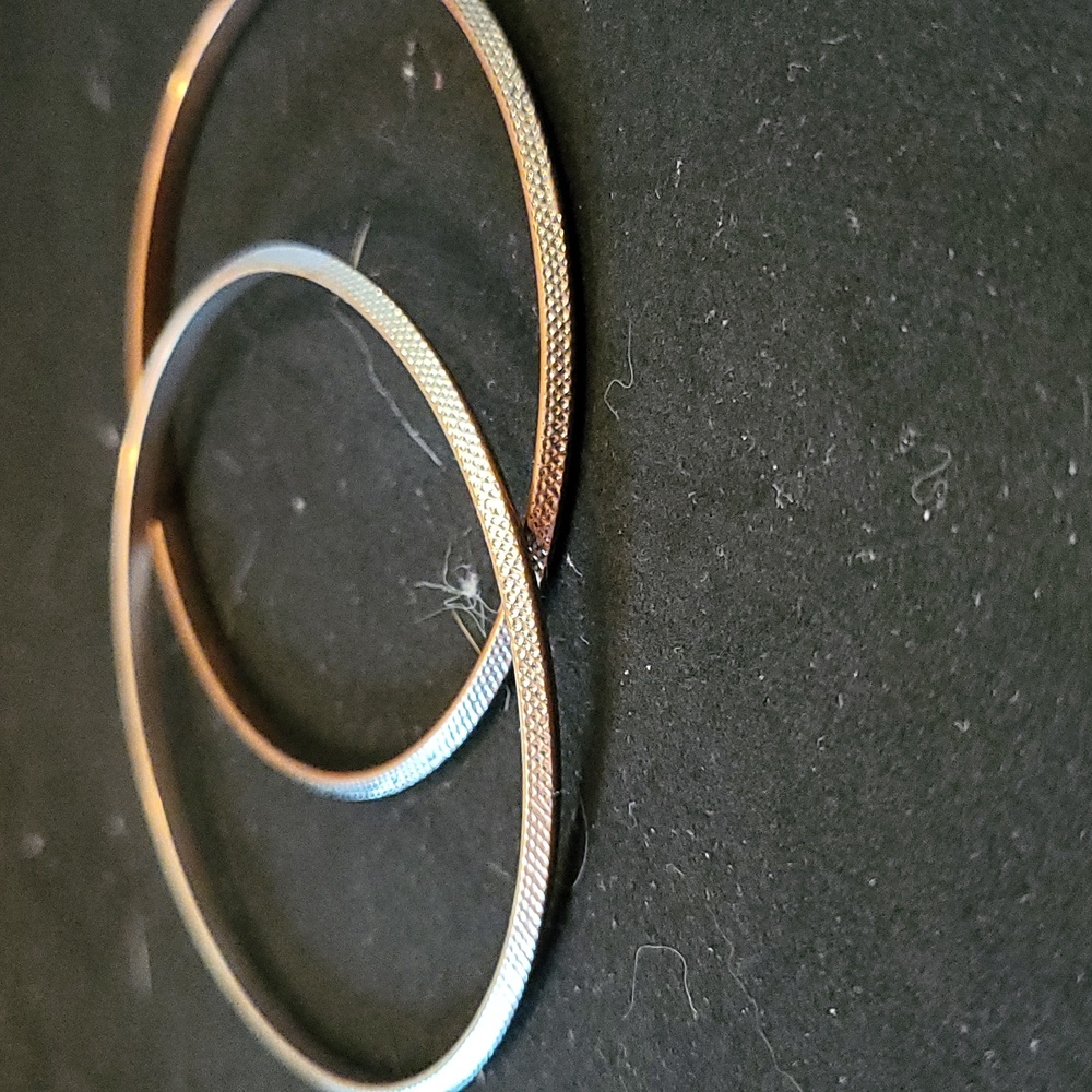 Two metal bracelets
